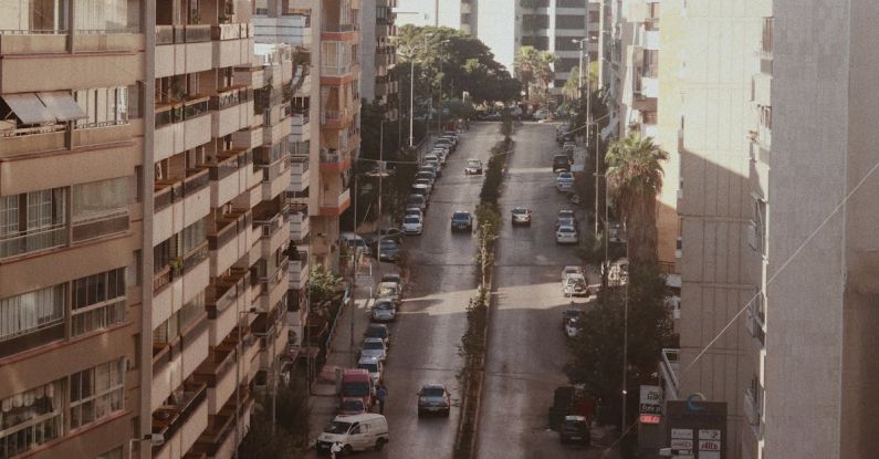 Traffic Ecommerce - Aerial View of a Busy Street between Apartment Blocks in City