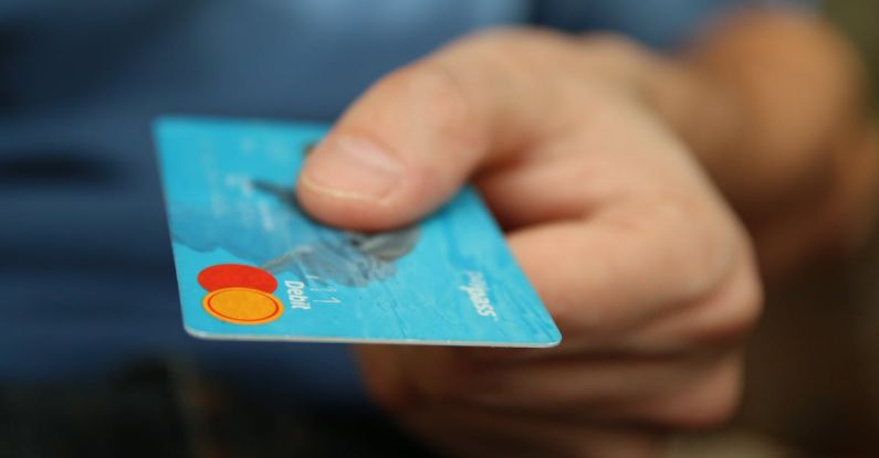 Ecommerce Analytics - Person Holding Debit Card