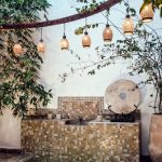 Authentic Influencer - Traditional oriental hammam pool on exotic resort spa terrace decorated with lush plants and stylish lanterns