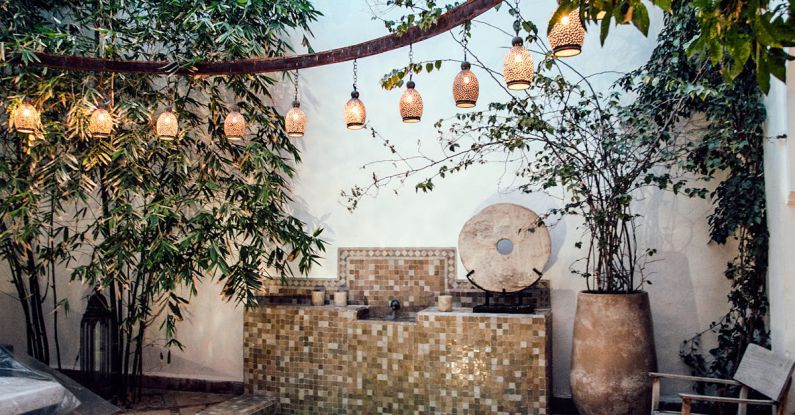 Authentic Influencer - Traditional oriental hammam pool on exotic resort spa terrace decorated with lush plants and stylish lanterns