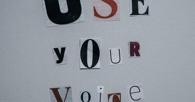 Campaign Influencer - Use Your Voice inscription on gray background