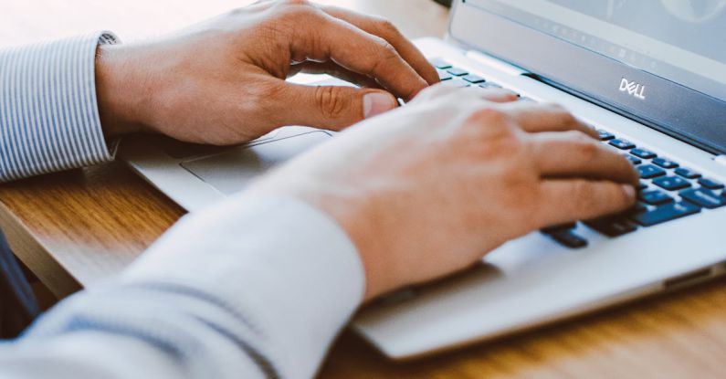 Seo Writing - Man Using Dell Laptop