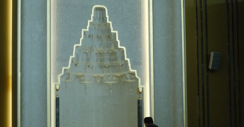 Niche Influencer - A man stands in front of a large mosque