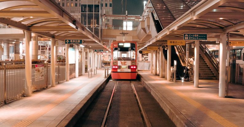 Ad Platforms - A train is traveling through a train station at night