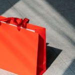 Ad Fraud - Red paper shopping bag on gray ground