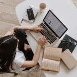 Technical Seo - Young lady typing on keyboard of laptop in living room