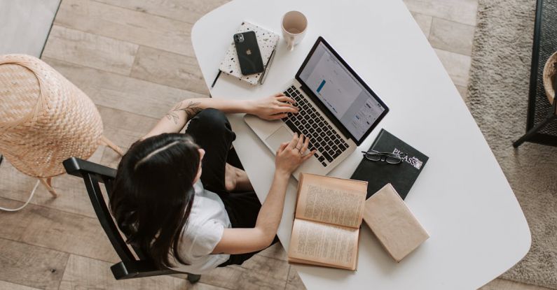 Technical Seo - Young lady typing on keyboard of laptop in living room