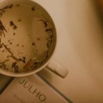 Email Calendar - A cup of tea on a table with a book