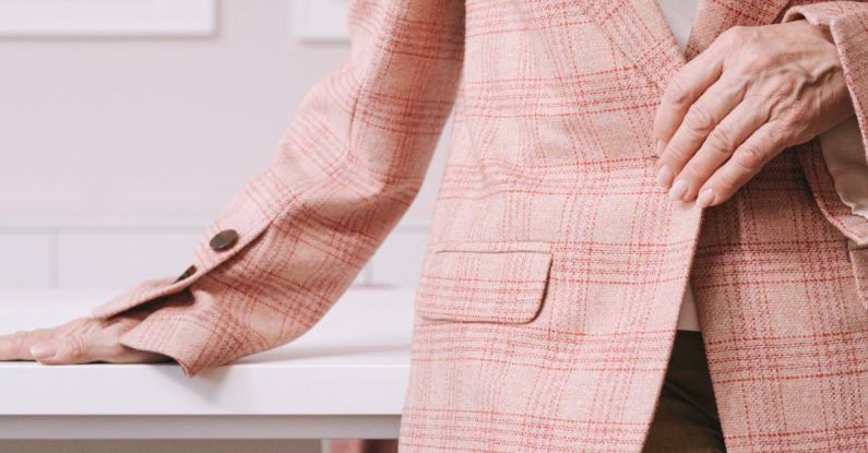 Transactional Email - Woman in Pink and White Plaid Blazer Sitting on Brown Wooden Chair