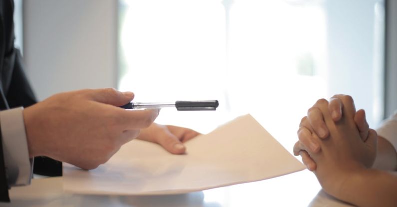 Email Signature - Crop businessman giving contract to woman to sign