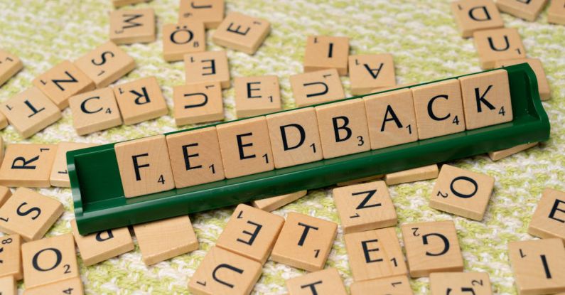 Customer Feedback - The word feedback is spelled out with scrabble tiles