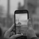 Mobile Optimization - A man taking a photo of a mosque