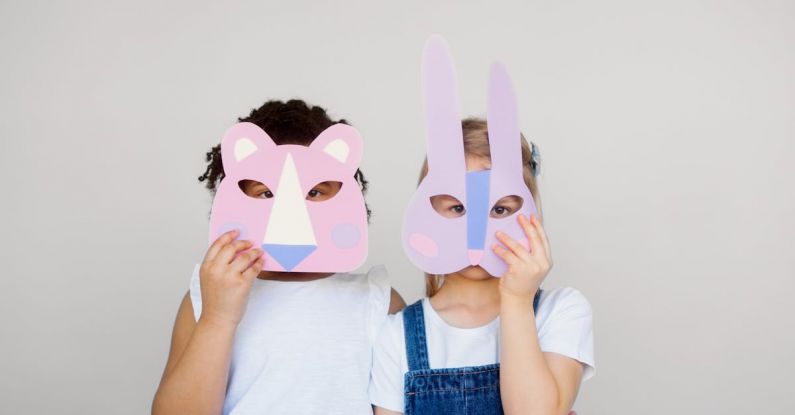 Emotion Design - Two Kids Covering Their Faces With a Cutout Animal Mask