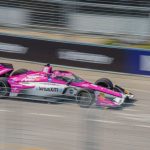 Call-to-action - A racing car is driving down a track