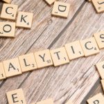 Predictive Analytics - The word analytics spelled out in scrabble tiles