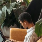 Analytics Strategy - Man in White Dress Shirt Sitting on Brown Chair