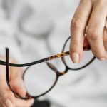 Ecommerce Analytics - Person Holding Brown Framed Eyeglasses