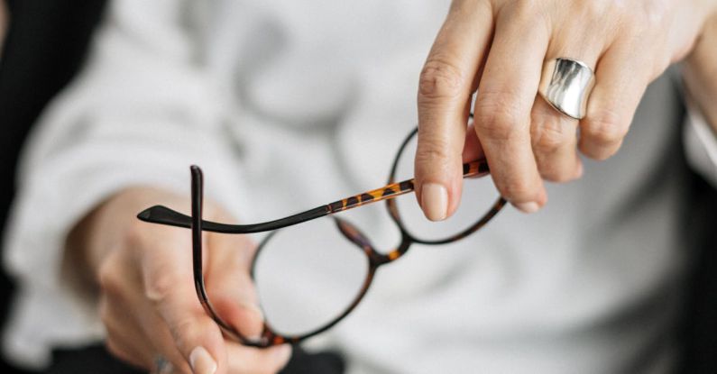 Ecommerce Analytics - Person Holding Brown Framed Eyeglasses